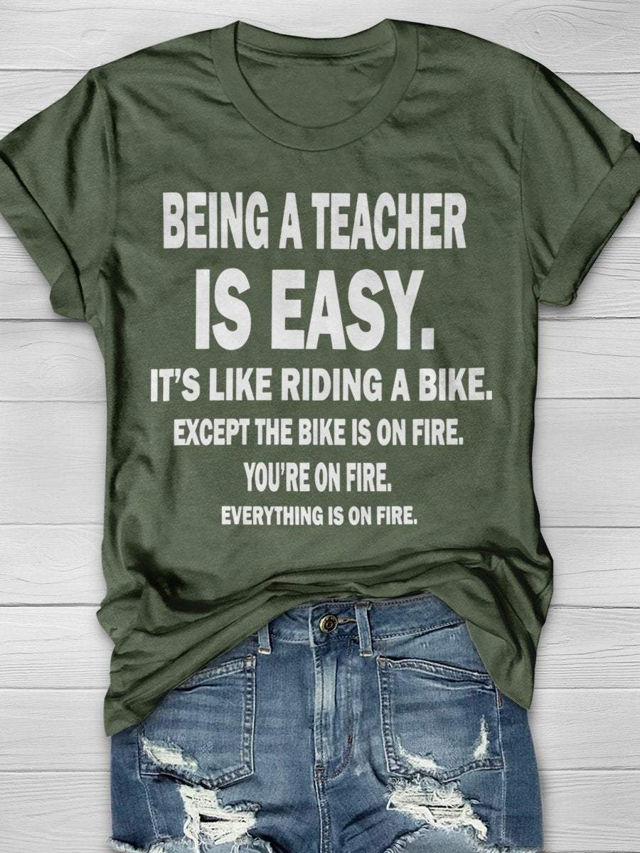 Being A Teacher Is Easy It's Like Riding A Bike Except The Bike Is On Fire Everything Is On Fire Print Graphic T-shirts