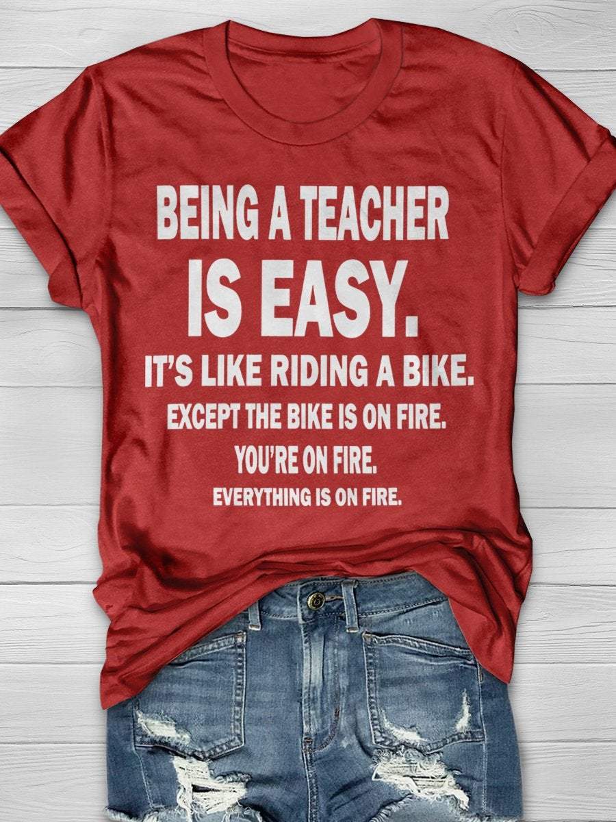 Being A Teacher Is Easy It's Like Riding A Bike Except The Bike Is On Fire Everything Is On Fire Print Graphic T-shirts