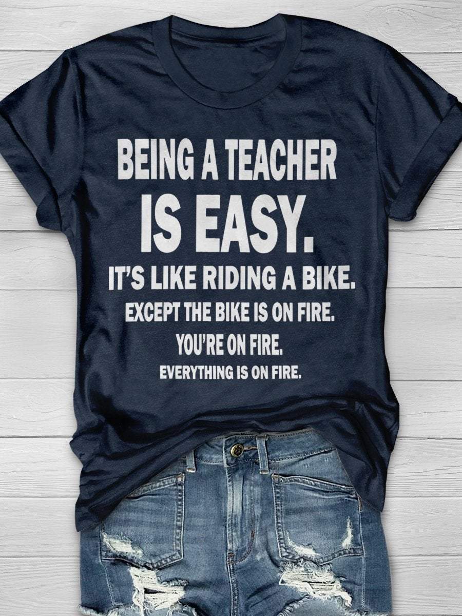 Being A Teacher Is Easy It's Like Riding A Bike Except The Bike Is On Fire Everything Is On Fire Print Graphic T-shirts