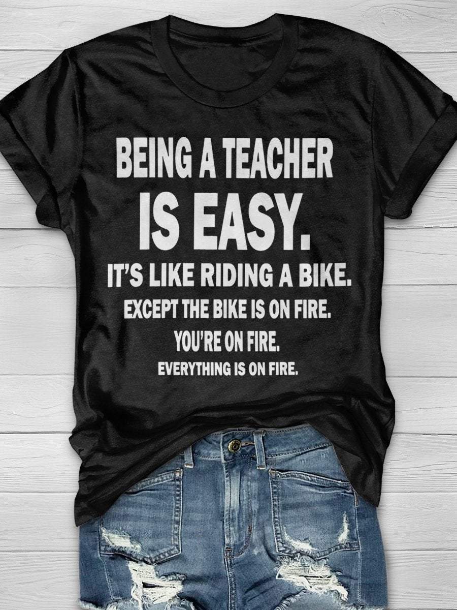 Being A Teacher Is Easy It's Like Riding A Bike Except The Bike Is On Fire Everything Is On Fire Print Graphic T-shirts