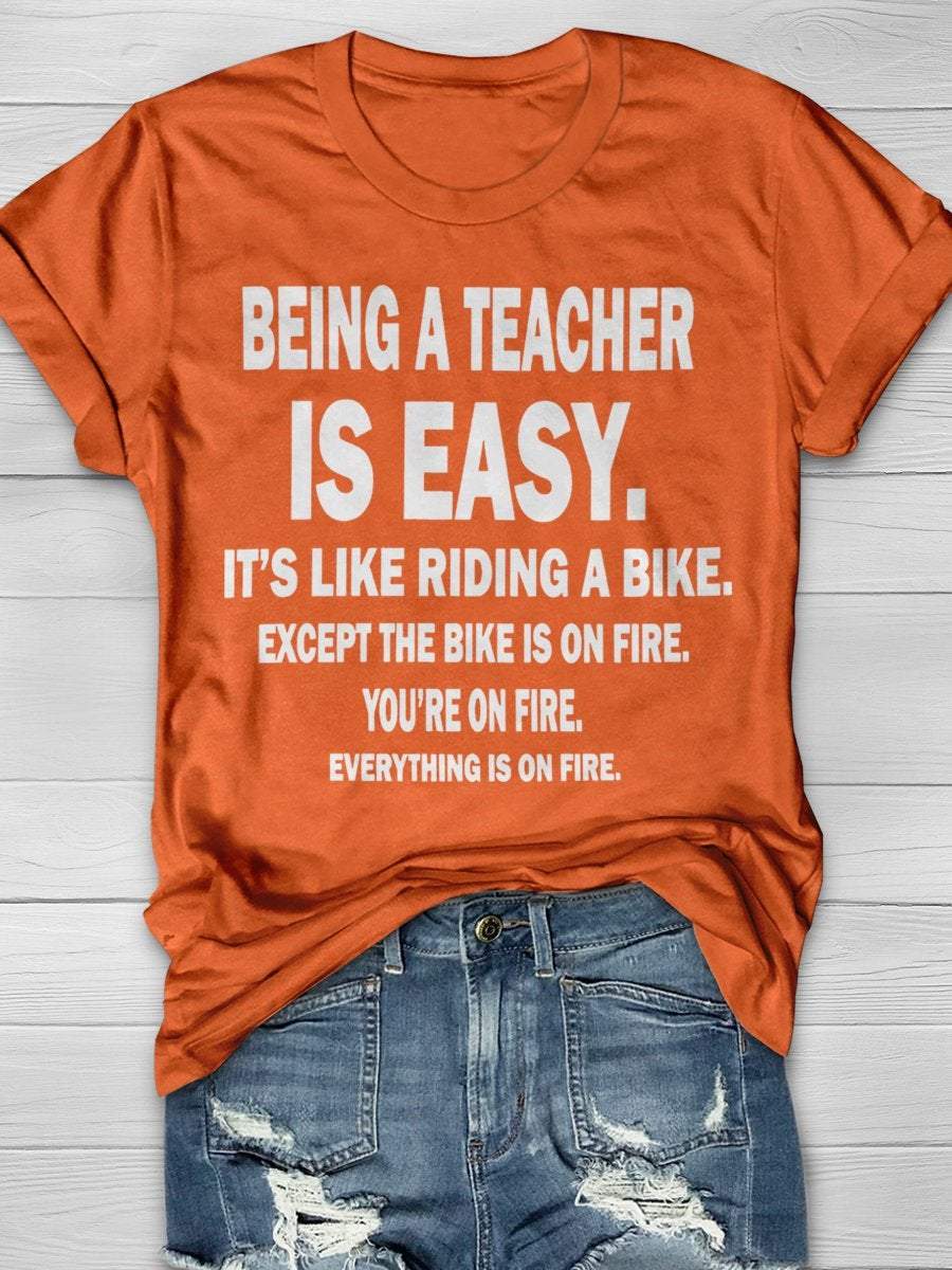 Being A Teacher Is Easy It's Like Riding A Bike Except The Bike Is On Fire Everything Is On Fire Print Graphic T-shirts