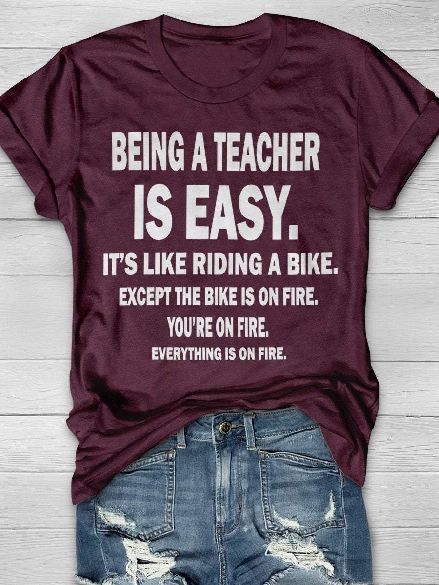 Being A Teacher Is Easy It's Like Riding A Bike Except The Bike Is On Fire Everything Is On Fire Print Graphic T-shirts